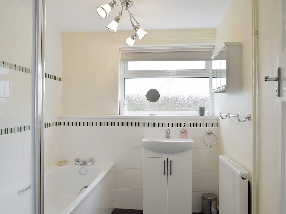 Family bathroom with shower over bath | Rose Farm Cottage, Frostenden, near Beccles