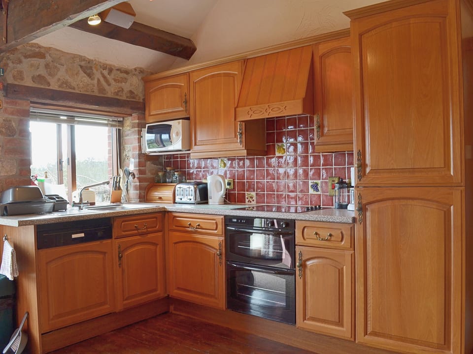 The well-equipped kitchen benefits from Biomass underfloor heating | Whitwell Farm CottagesAshley&rsquo;s, Whitwell Farm, Colyford, near Seaton