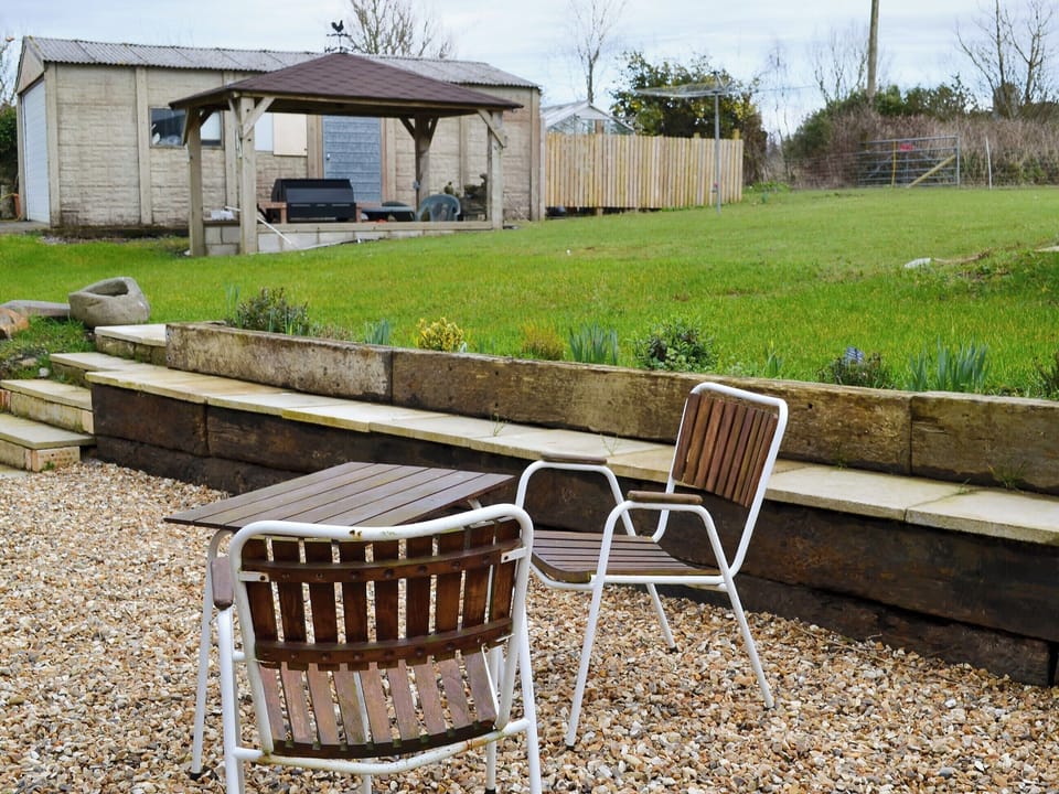 Large garden with patio, garden furniture and gas barbecue | Knotty Corner Cottage, Fairy Cross, near Bideford