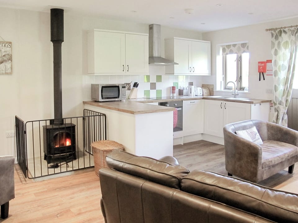 Delightful open plan living space with cosy wood burner | The Old Parlour, Whatlington, near Battle