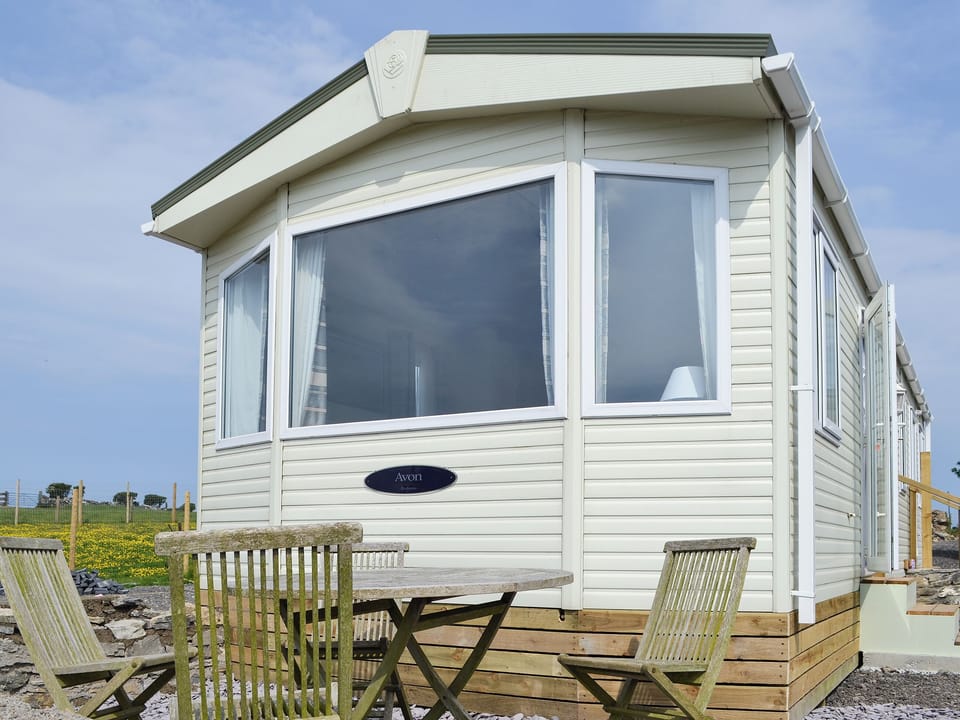 Exterior and sitting out area | Porthdy Crey r Wen - Neuadd Wen Cottages, Llanfachraeth, near Holyhead