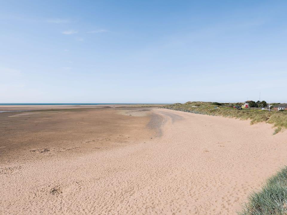 Wide expansive sandy beaches are within walking distance | Lazy Cottage, Haverigg, near Millom