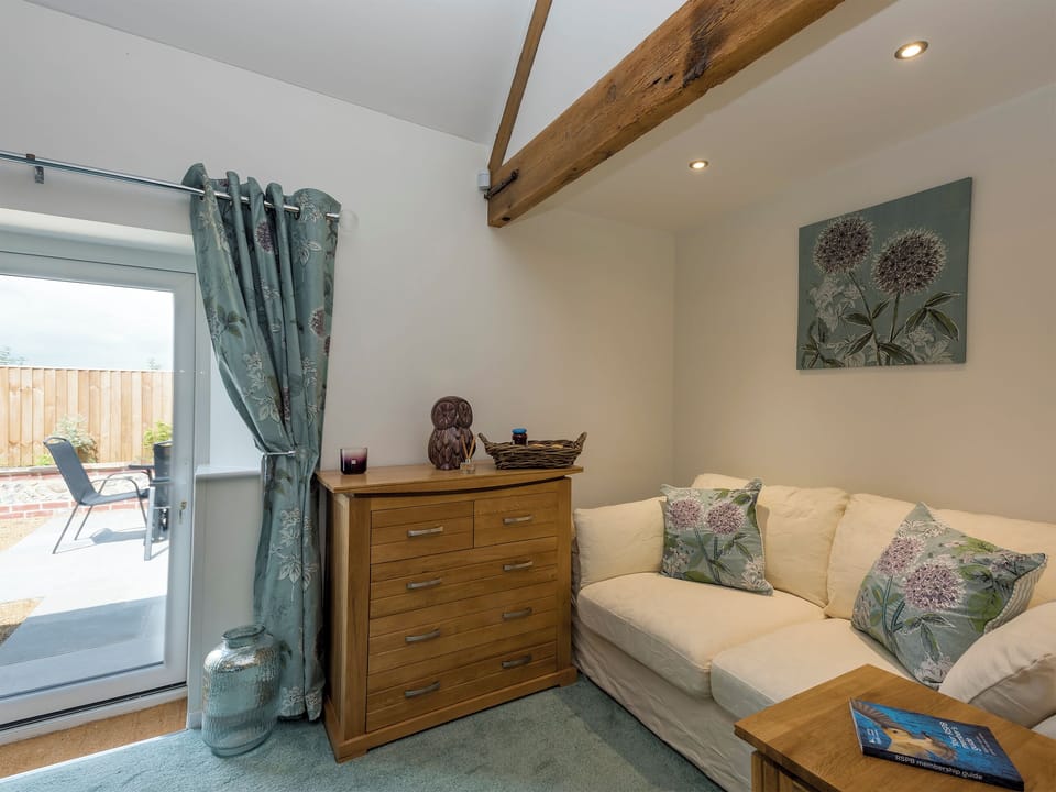 Seating/dressing area within double bedroom | The Cowshed, Horning, near Wroxham