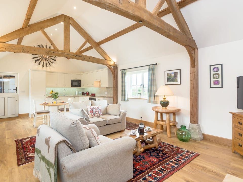 Spacious open plan living space with beamed ceiling | The Old Dairy - Wood Street Farm, Royal Wootton Bassett