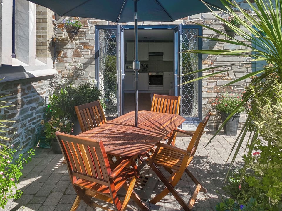 Enclosed patio with outdoor furniture and BBQ | Old Church School, Plympton, near Plymouth
