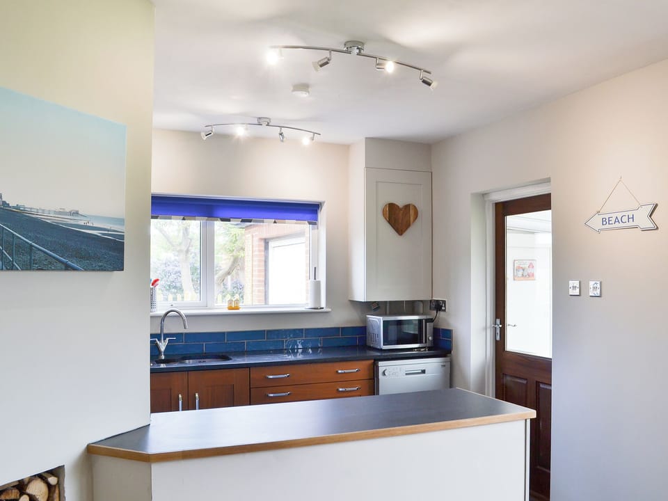 Kitchen with breakfast bar | Sea La Vie, Mundesley, near North Walsham