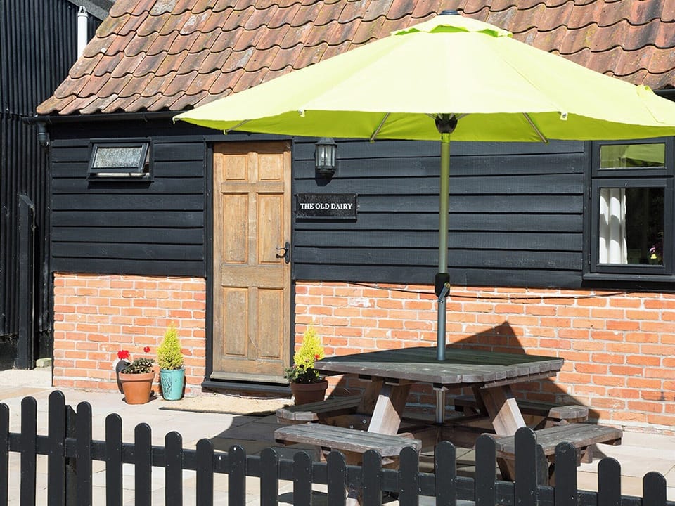 Enclosed patio area with outdoor furniture | Old Dairy - Old Hall Farm Cottages, Walpole, near Halesworth