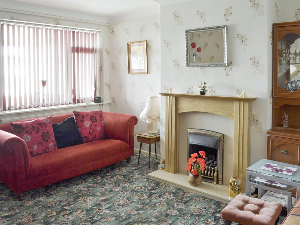 Comfortable double bedroom with patio doors to garden | Rossall Beach Cottage, Rossall, near Thornton-Cleveleys.