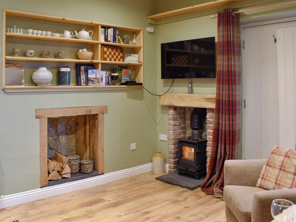 Cosy living room area with wood burner | Sycamore Cottage, Consett
