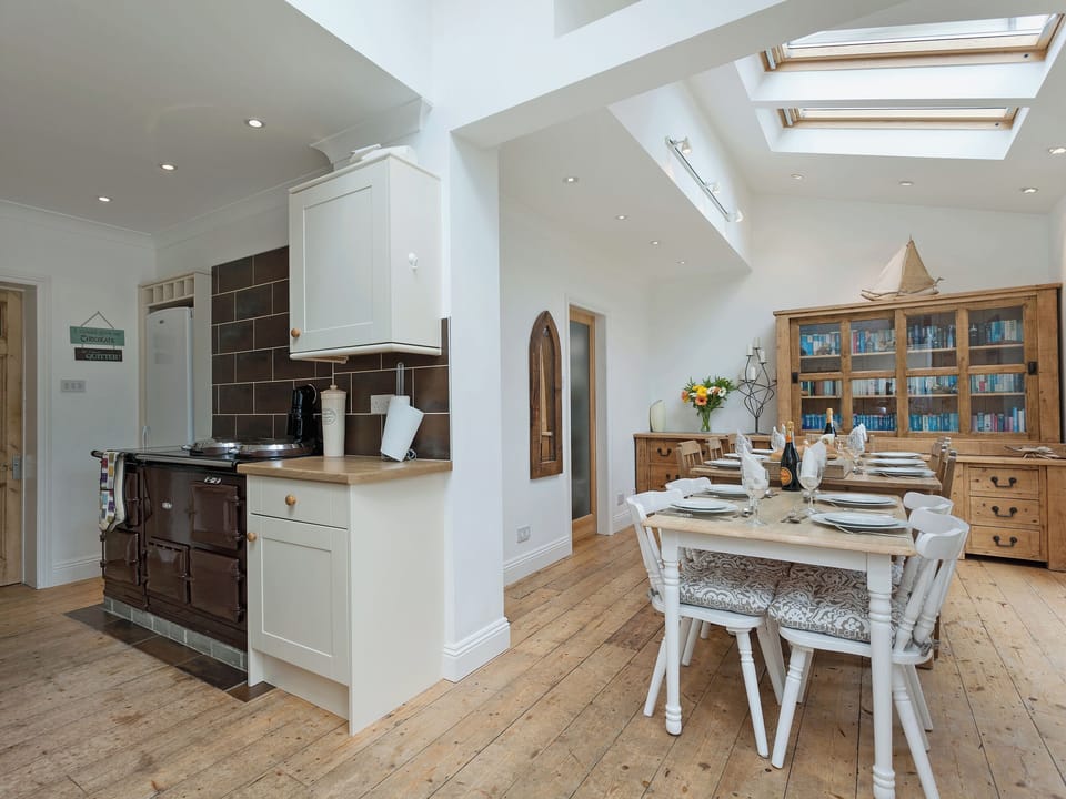 Spacious kitchen/dining room with doors leading to the garden | Stourcliffe House, Bournemouth
