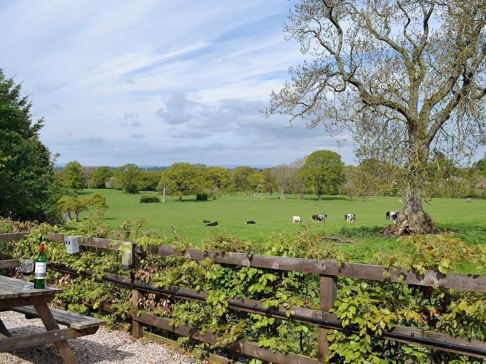 Views over the fields and picnic style seating | Swallow Cottage - Lakerigg, Dalston, near Carlisle