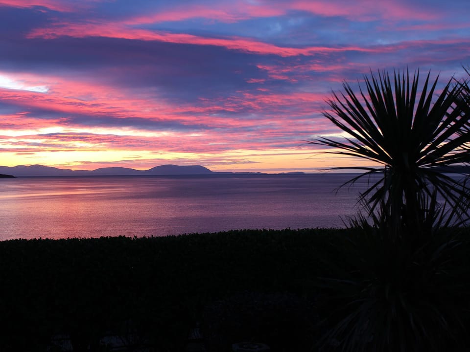 Stunning sunsets over the loch. | Beach Cottage, Clachangarbh, Gairloch