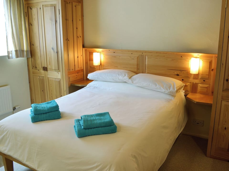 Comfortable double bedroom | Morvoren - Polhaun Holiday Apartments, Mevagissey, near St Austell