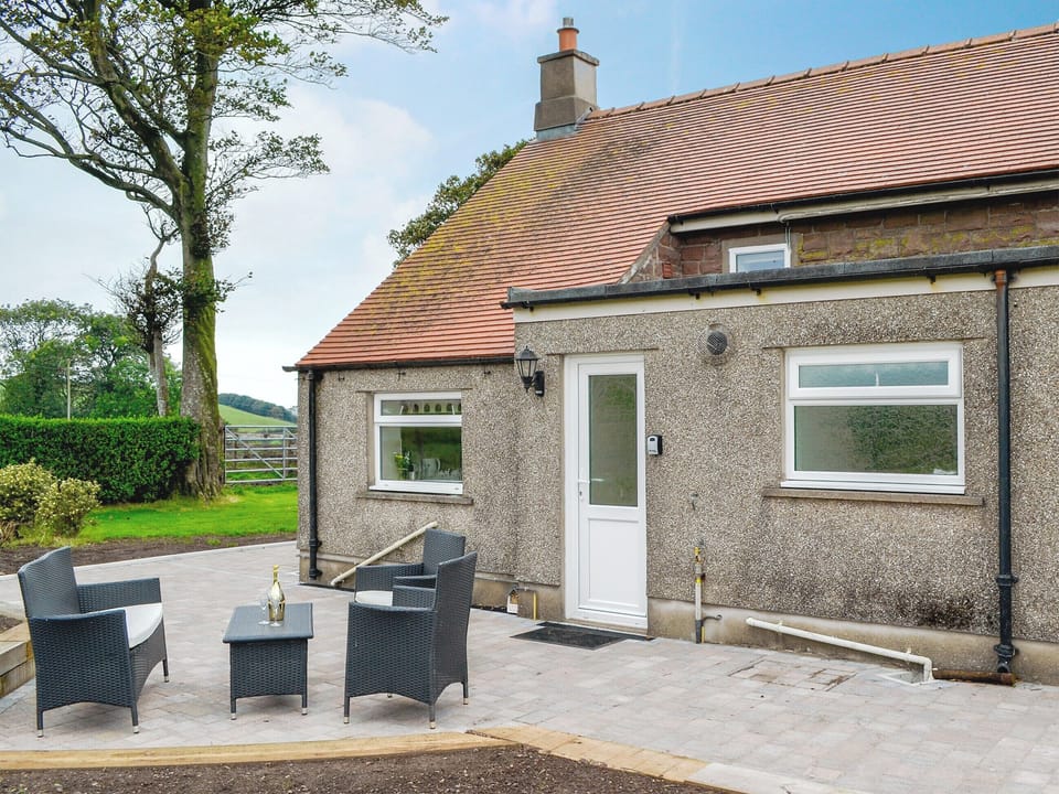 Patio with sitting out area | Rose Cottage - Springfield Farm Cottages, Bigrigg, near Egremont