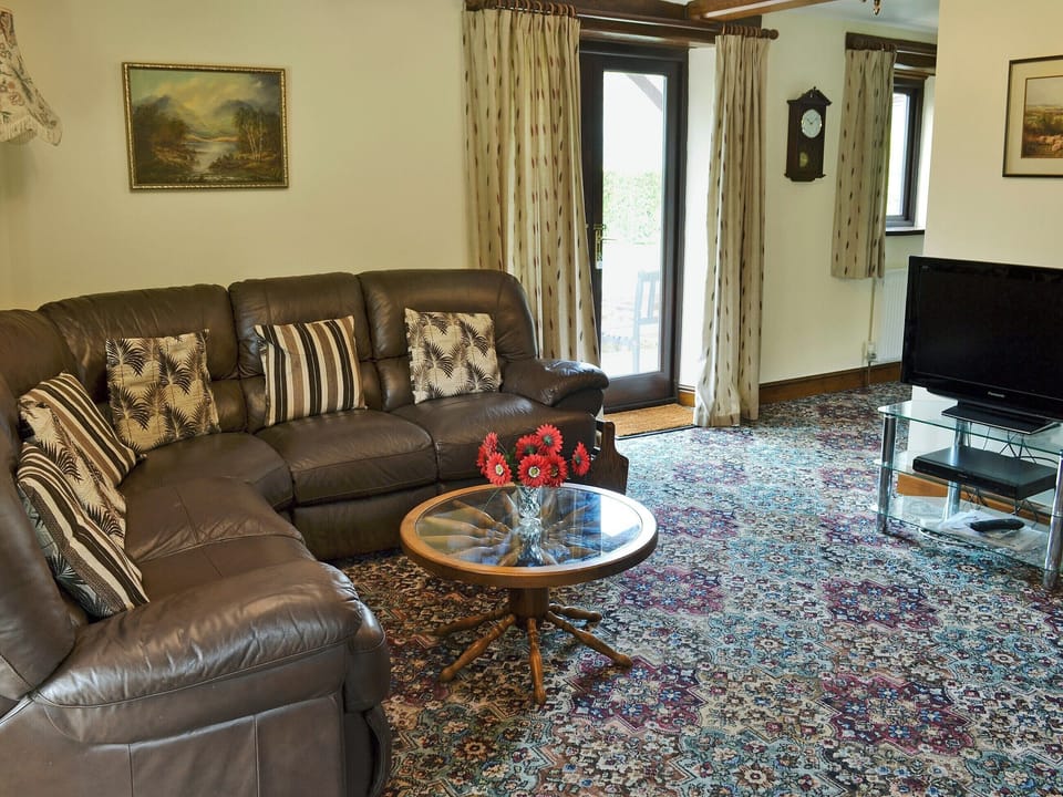 Homely living room with wood burner | Stowford Barton Cottage - Swallows Nest - Stowford Barton Cottages, Stowford, Okehampton