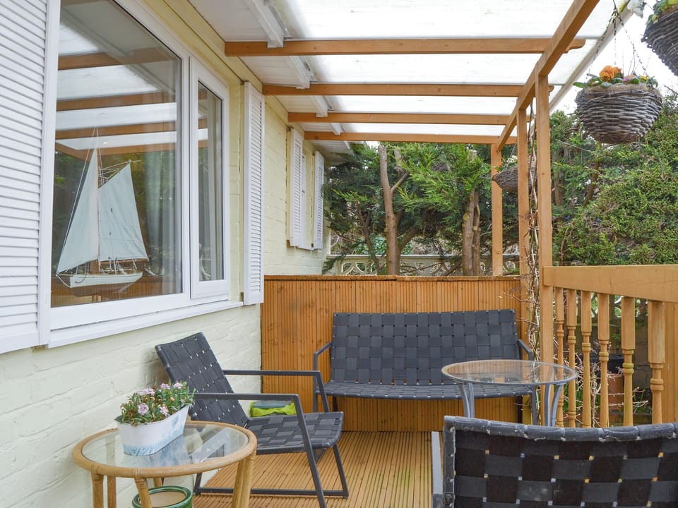 Covered outdoor seating area | Stable Cottage, Gunville, near Newport