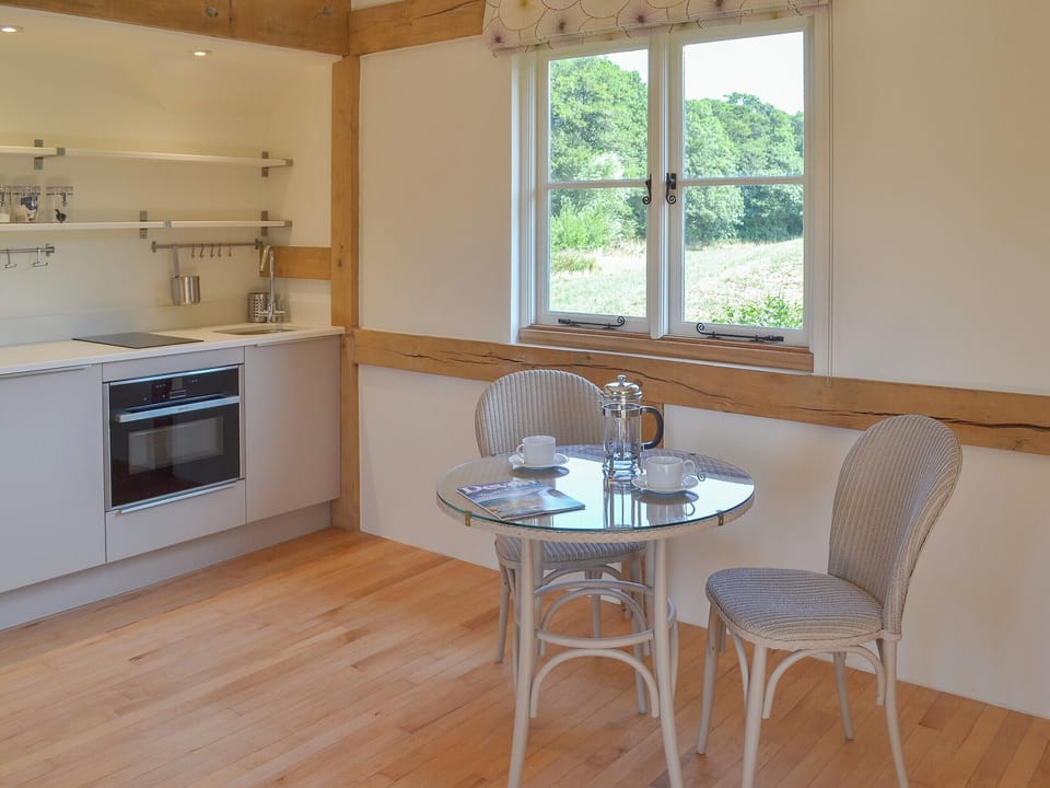 Dining area and well-appointed kitchen | The Piglet, Sidbury, near Sidmouth