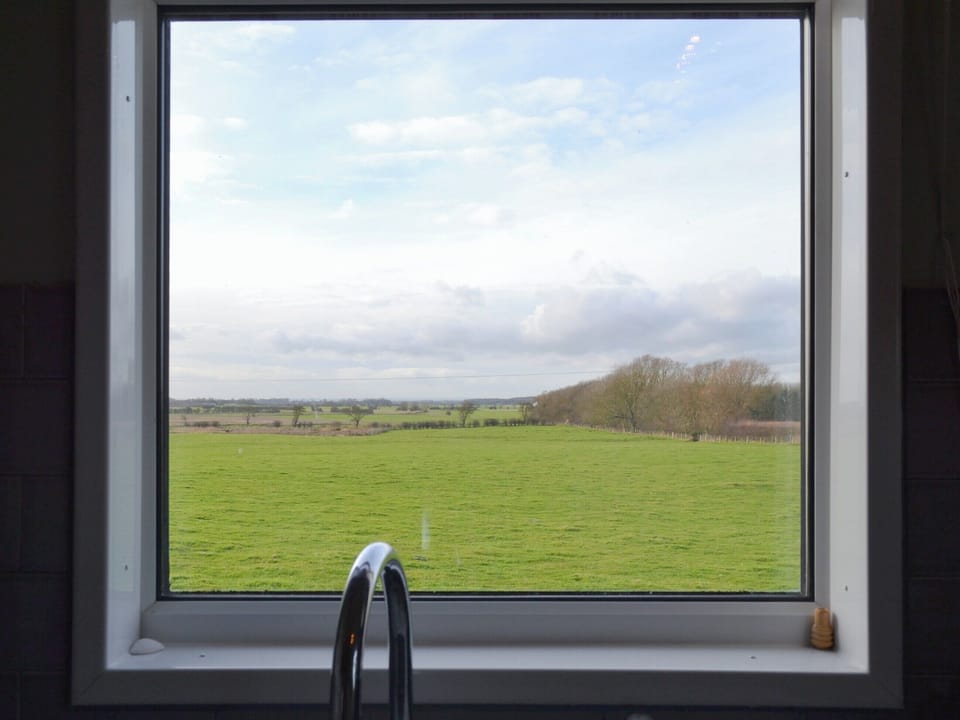 Peaceful rural view from the kitchen | Searchlight Cottage, Fraisthorpe, near Bridlington