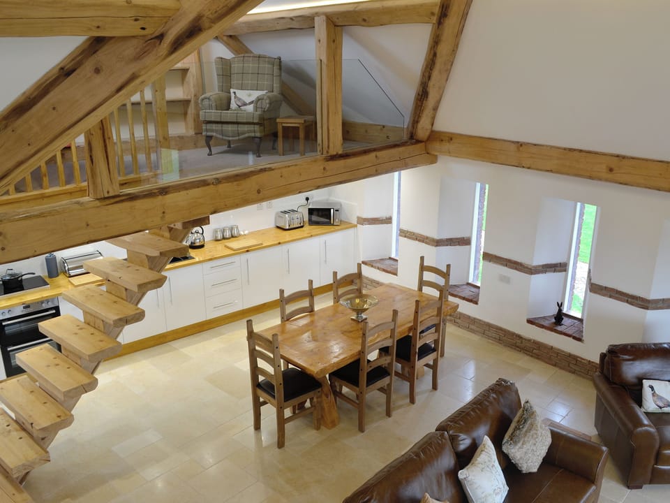 View from the second mezzanine over the open-plan living space | Combe View - Lower North Radworthy Cottages, Heasley Mill, near South Molton