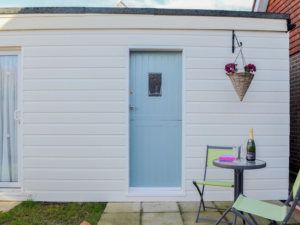Private flagged sitting out area | The Cabin, Pevensey Bay, near Eastbourne