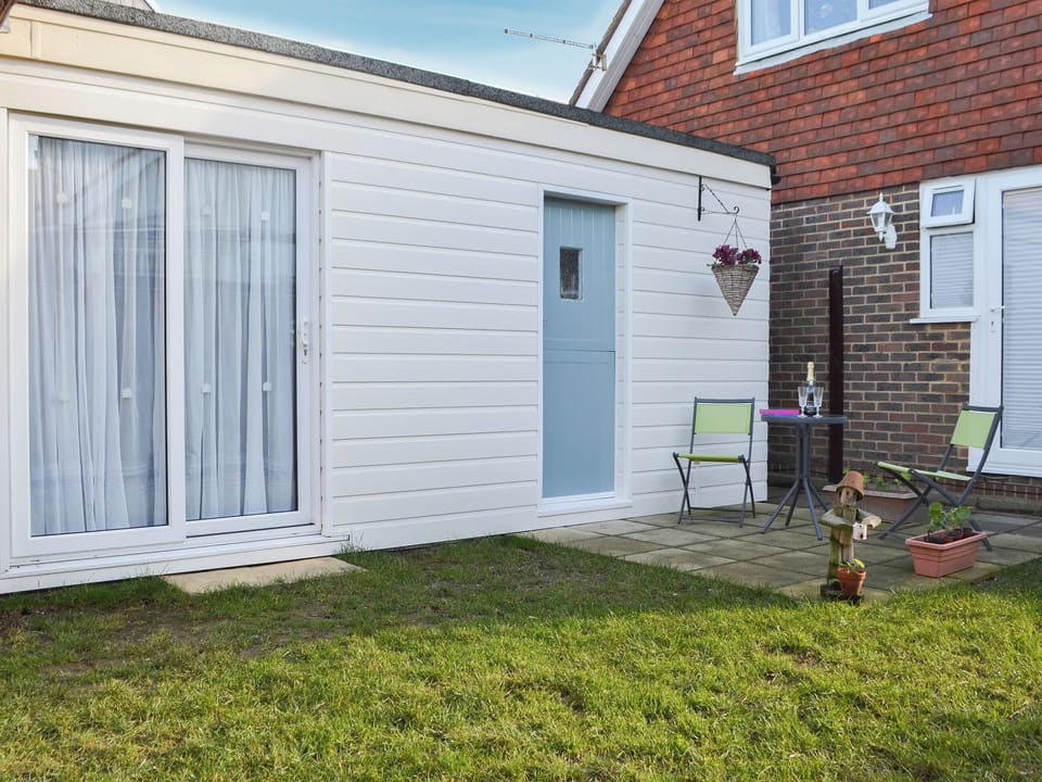 Garden area with seating | The Cabin, Pevensey Bay, near Eastbourne