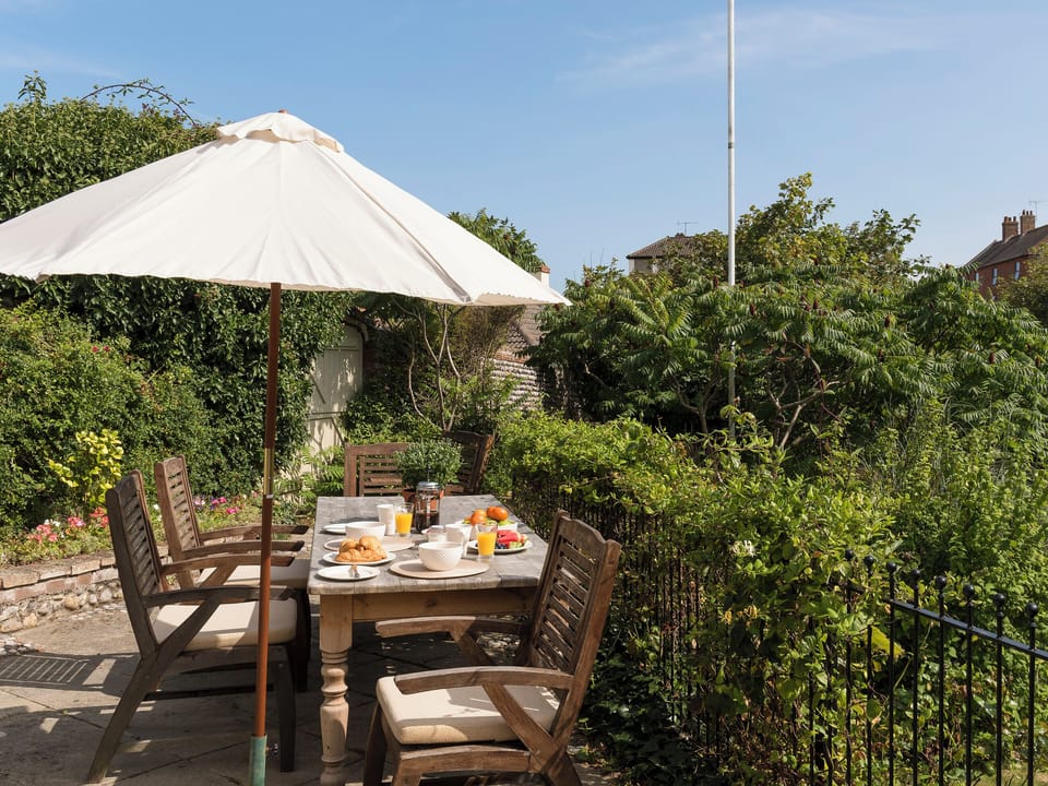 Spectacular patio area looking over the garden | Dell Cottage, Mundesley, near North Walsham