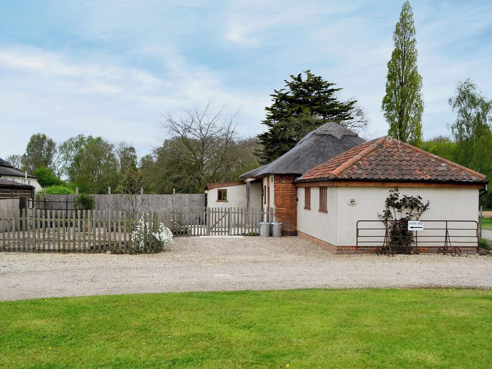 Spacious enclosed garden with sitting-out area and garden furniture | The Cowshed, Blofield, near Norwich