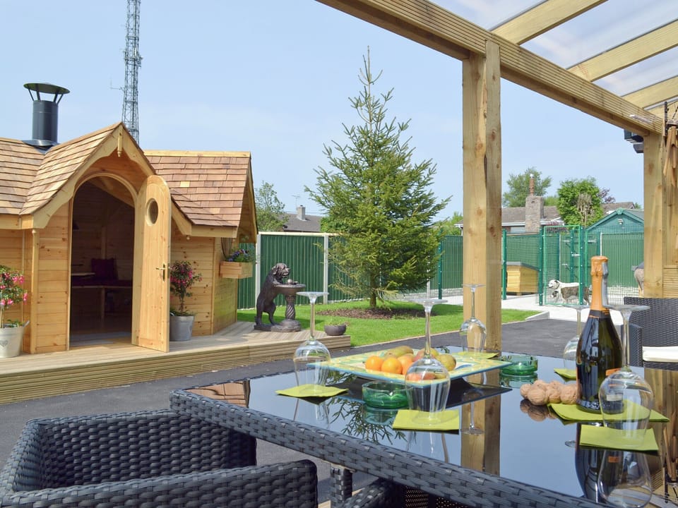 Outdoor eating area within covered terrace | Hillcrest House, Brown Edge, near Leek