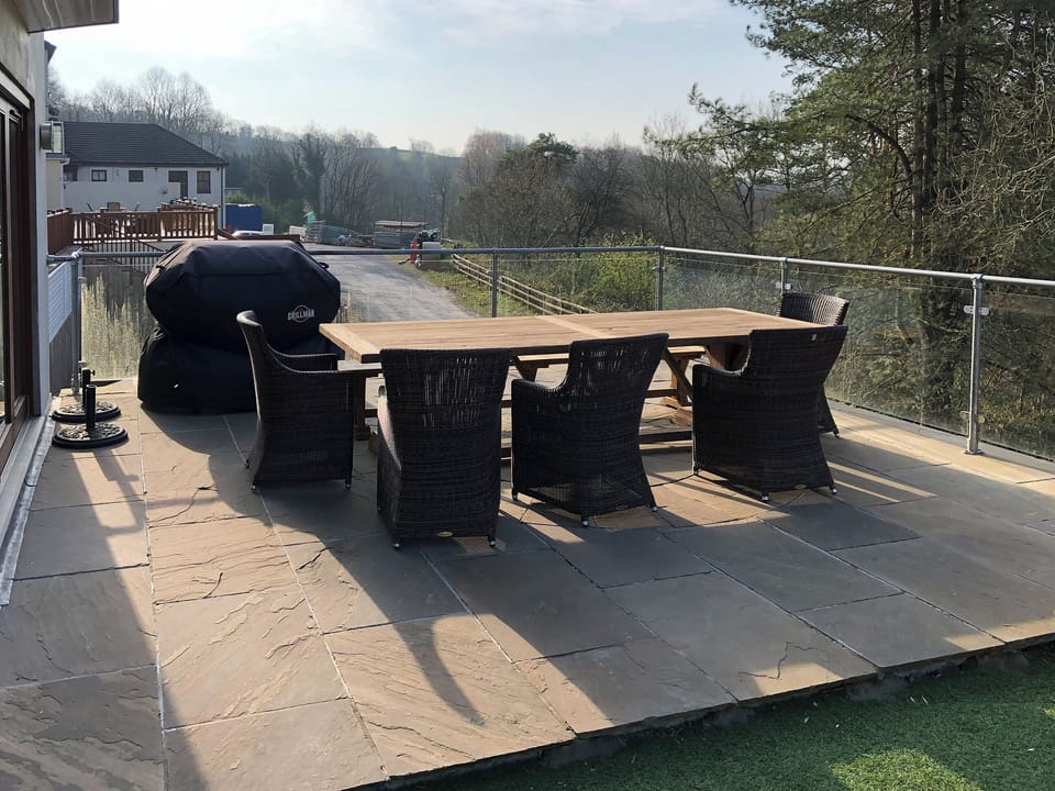 Paved patio area with seating | Hafan Dawel, Stepaside, near Saundersfoot