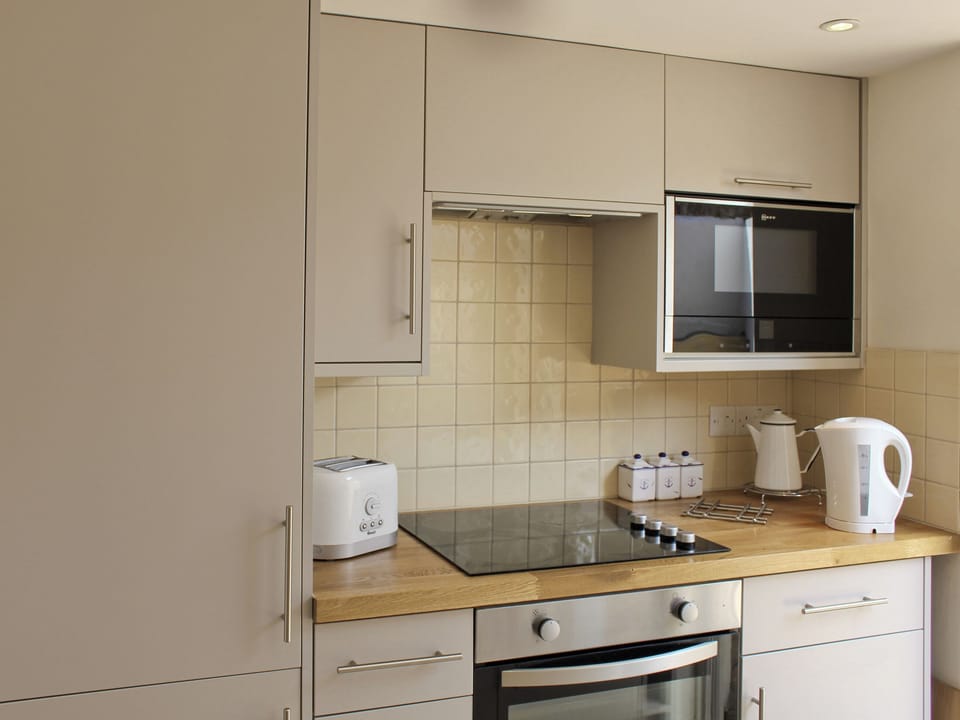 Open plan contemporary style kitchen and diner | Anchor Cottage, Deal