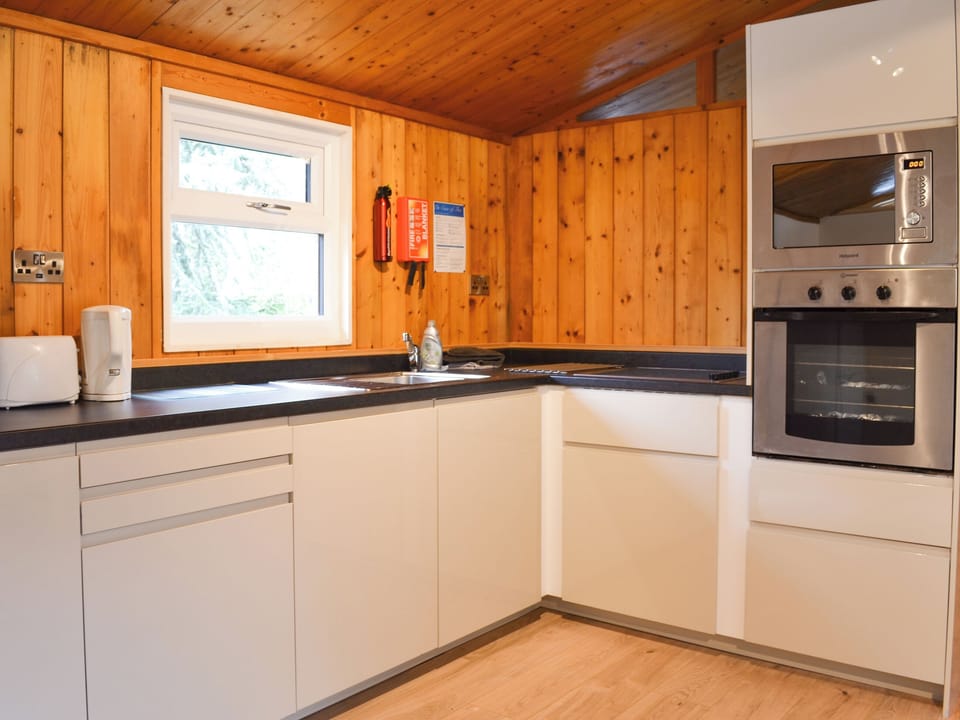 Well fitted kitchen area with all appliances | Cedar Lodge, Charlcot, near Masham