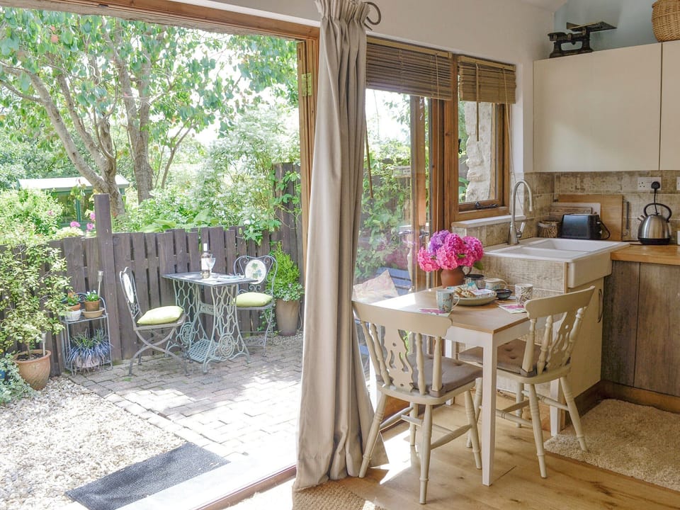Open plan living space with double doors to patio area | The Figgery, Bittaford, near Ivybridge