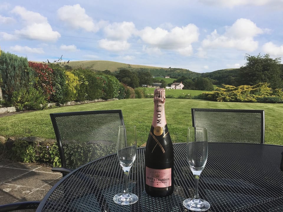 There is a delightful sitting out area in the garden | The Old Post Office, Myddfai, near Llandovery