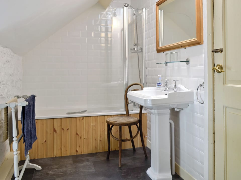 Family bathroom with shower over bath | Riverside Cottage, Betws-y-Coed