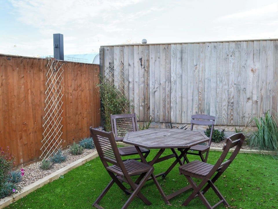 Enclosed courtyard with sitting-out area and garden furniture | Ravenna, Anderby Creek, near Skegness