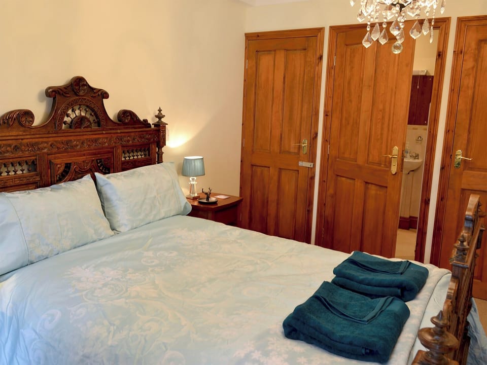 Spacious bedroom with kingsize bed and bunk bed | Trevellyan Barn, St Austell