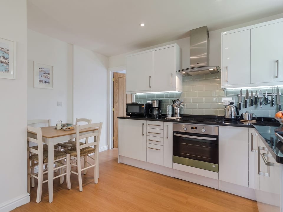Kitchen with dining area | Coachman&rsquo;s Cottage - Old Downs Farm, Sandwich Bay, near Sandwich