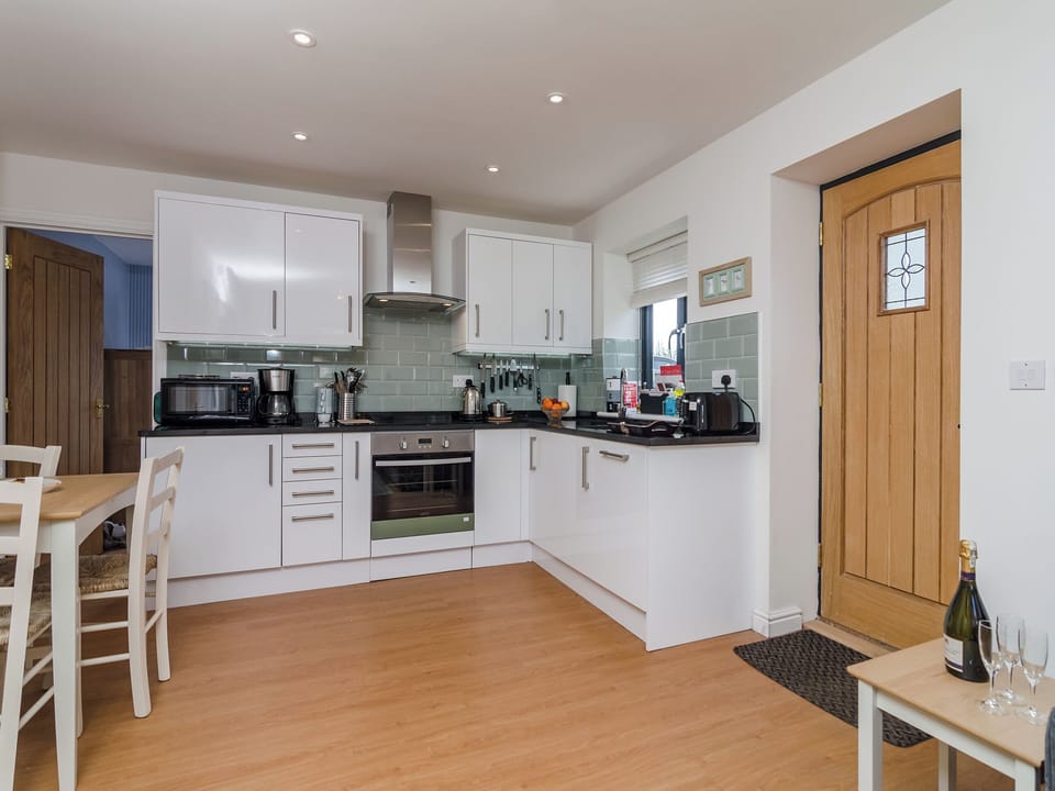 Kitchen with dining area | Coachman&rsquo;s Cottage - Old Downs Farm, Sandwich Bay, near Sandwich