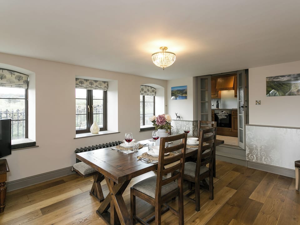 Dining room with oak flooring throughout | The Old Church, Alton, near Chesterfield