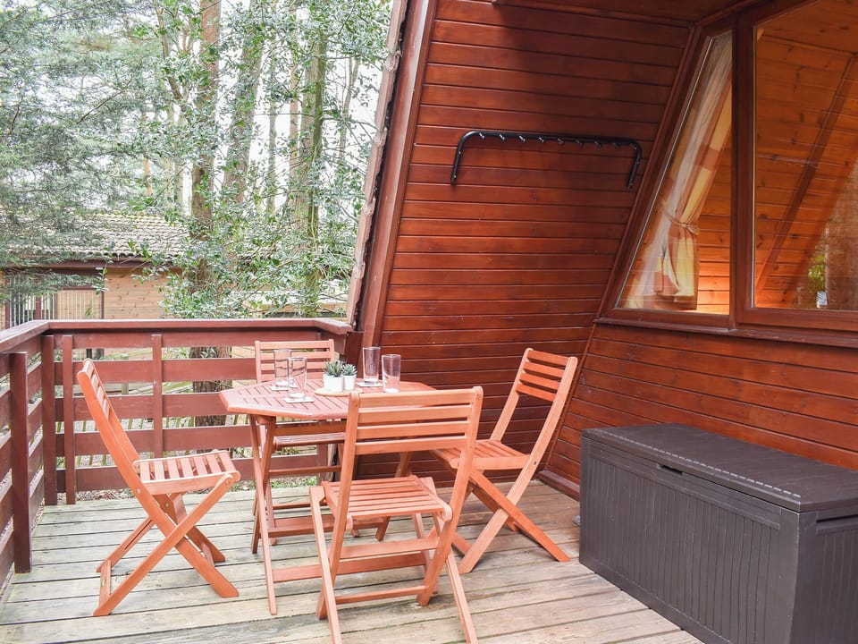 Decked balcony area with outdoor furniture | Bracken Lodge, Weybourne, near Sheringham