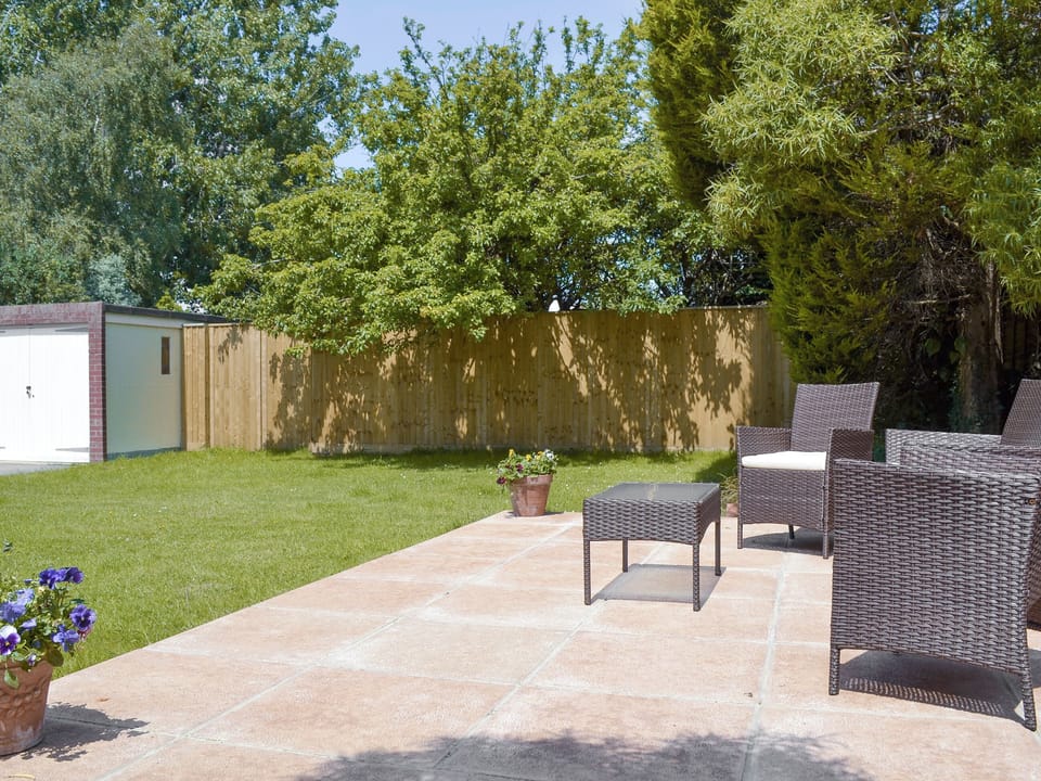 Sitting-out area with rattan furniture | Jasper, Broadstone, near Bournemouth