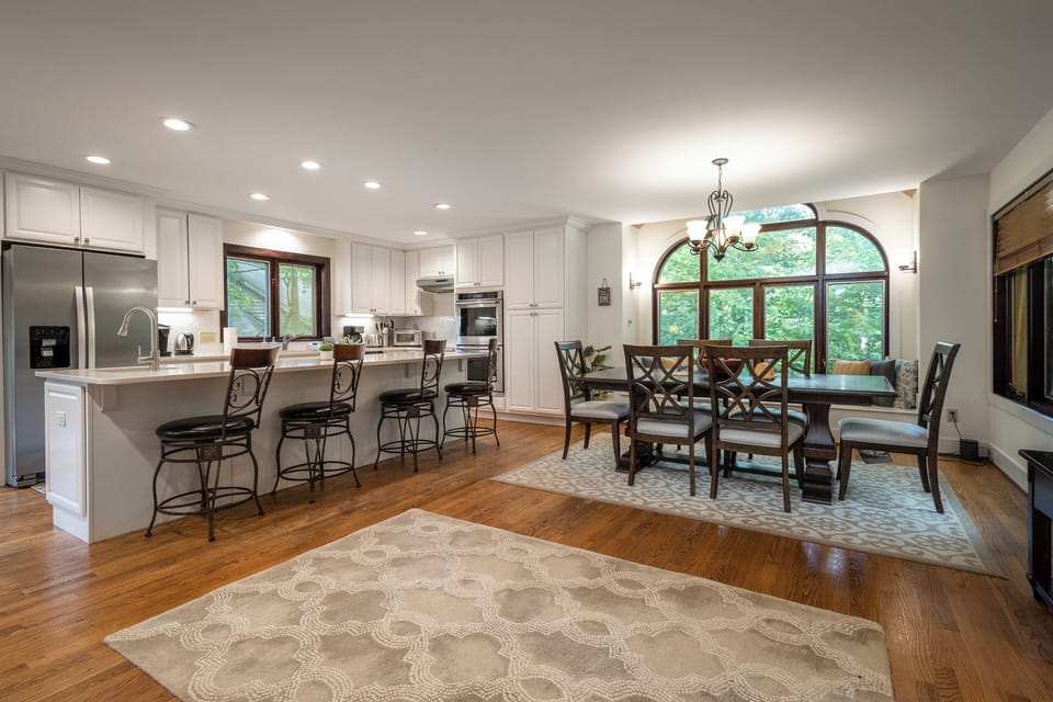 New Remodel Kitchen with stainless steel appliances.  New dining table