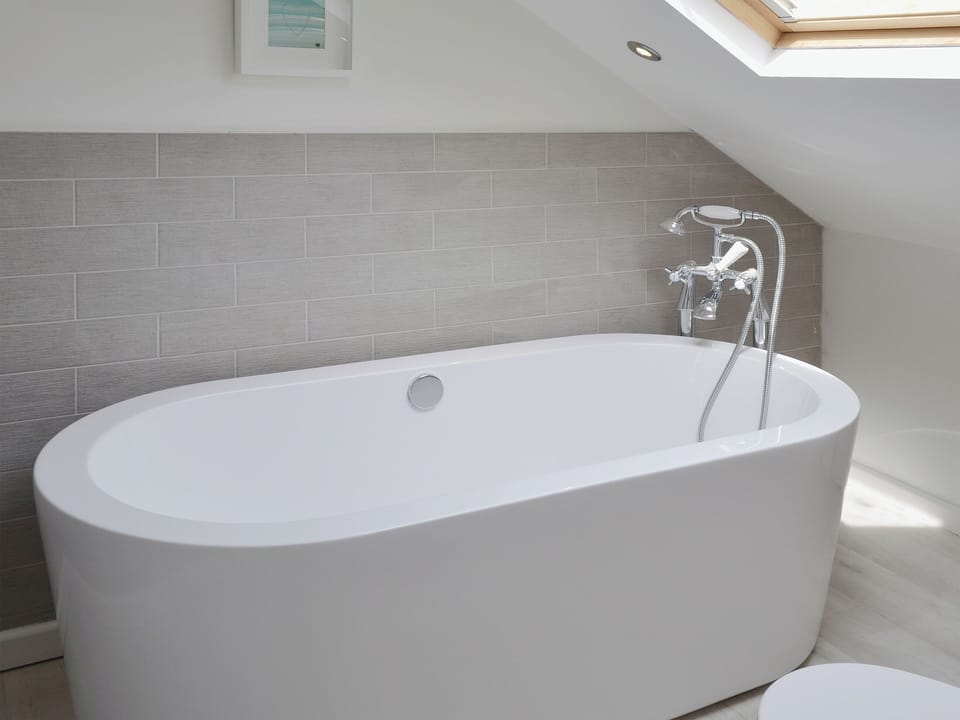 Contemporary standalsone bath in the en-suite | Abbeydale Town House, Whitby