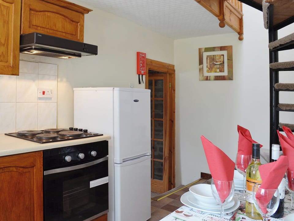 The kitchen area hs a bright and cheery atmosphere | Ty Coch Cottage, Near Aberaeron