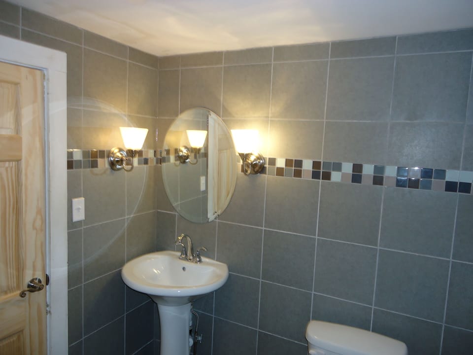 One of the 3 bathrooms with tub and shower