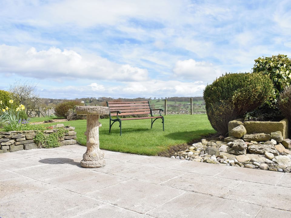 Paved patio area leading to garden | Paddock House, Middleham, near Leyburn