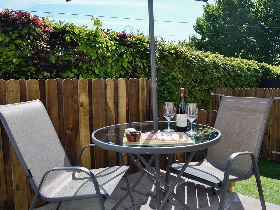 Well-kept garden with patio furniture and barbecue | Little Cottage, Wigtown