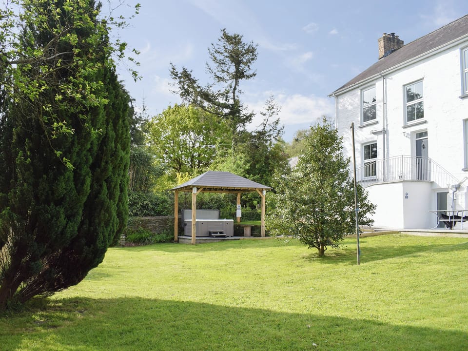 Garden with sheltered private hot tub | Maes yr Onnen, Abercych, near Cardigan