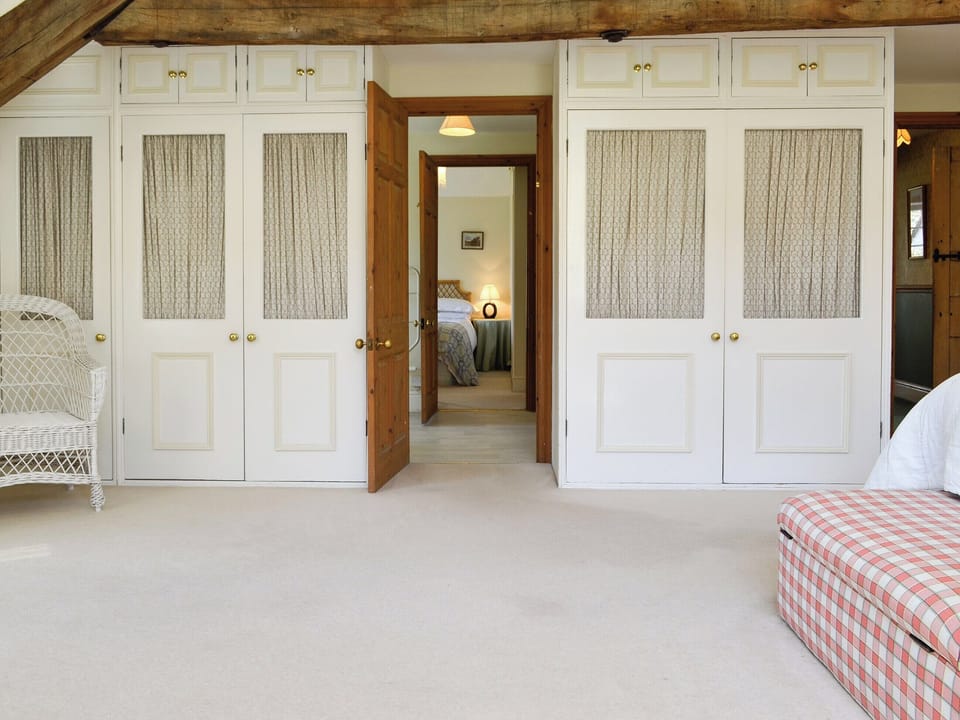 Ample storage and access to a shared en-suite bathroom | Crogen Coach House, Bala