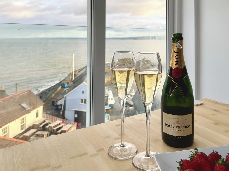 Charming dining area with wonderful harbour and sea views | Seascape, New Quay